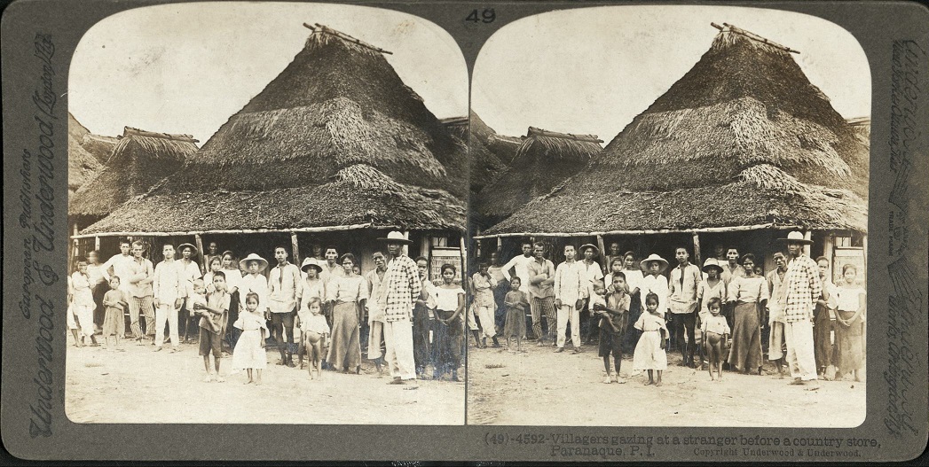 Villagers gazing at a stranger before a country store, Paran?aque, P I.